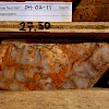 Kambaa Zone - DM-11-02: Fabric destructive silicification and sericitization accompanied by later limonite altered fracturing.